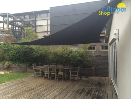 Picture showing one of our larger Right Angle Triangle 90 degree shade sail in black. Shade sail has been fixed to a sandstone rock with a 100mx100m wall plate.\\n\\n21/10/2014 9:14 PM